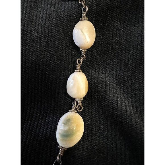 Shiva Eye Shell Necklace with sterling silver wire. Unique spherical beads. - Picture 5 of 8